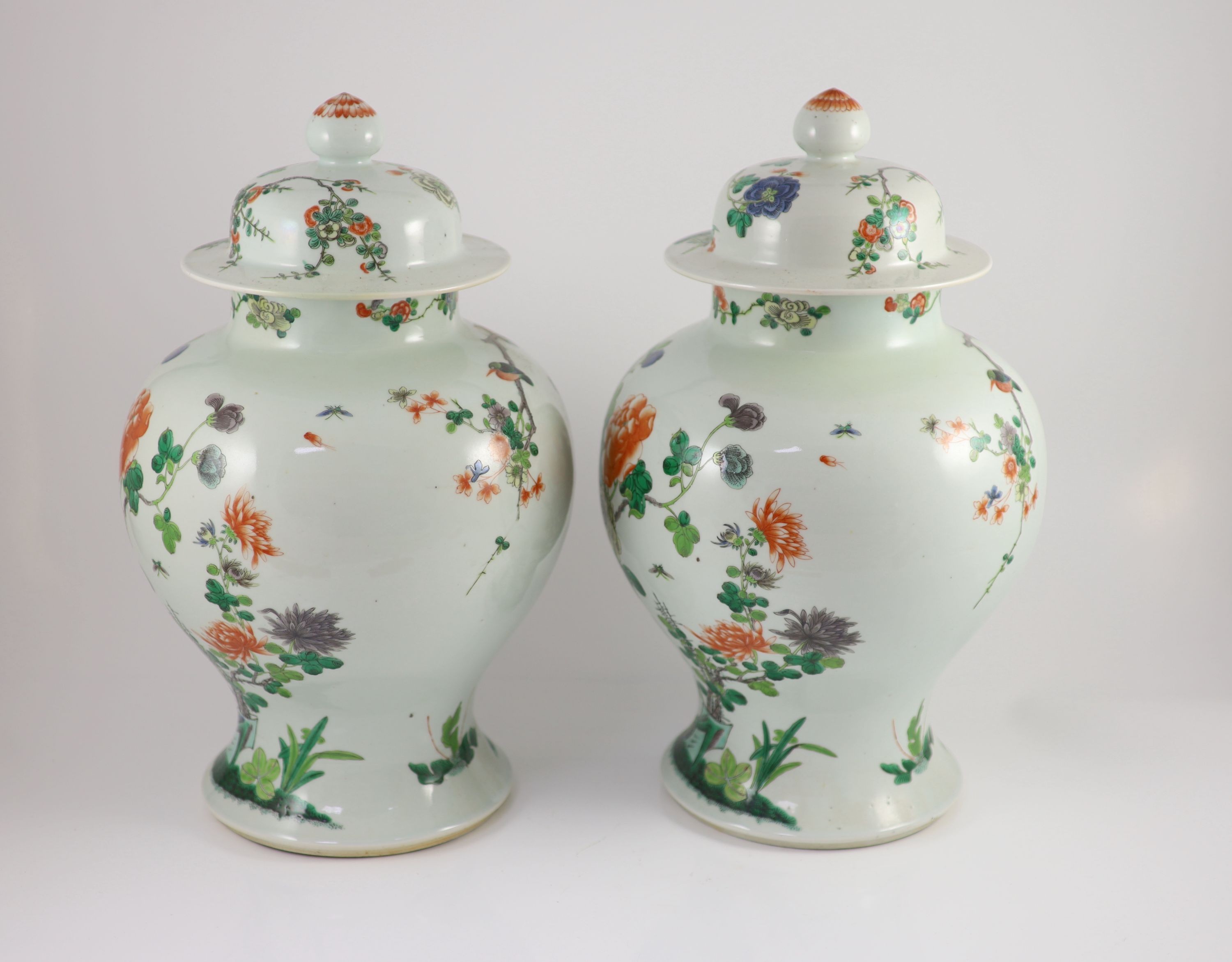 A pair of large Chinese famille verte jars and covers, late 19th century, 45cm high, restoration